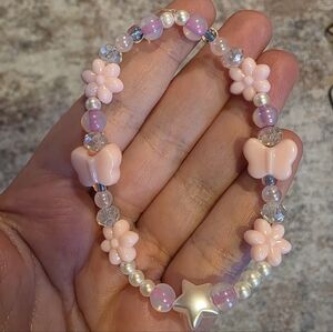 Pink Beaded Bracelet with Flower and Butterfly Accents